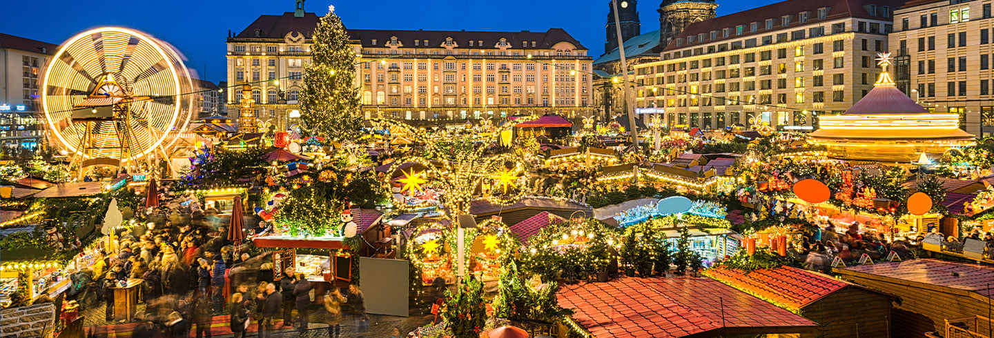 European Christmas market with festive lights and wooden stalls